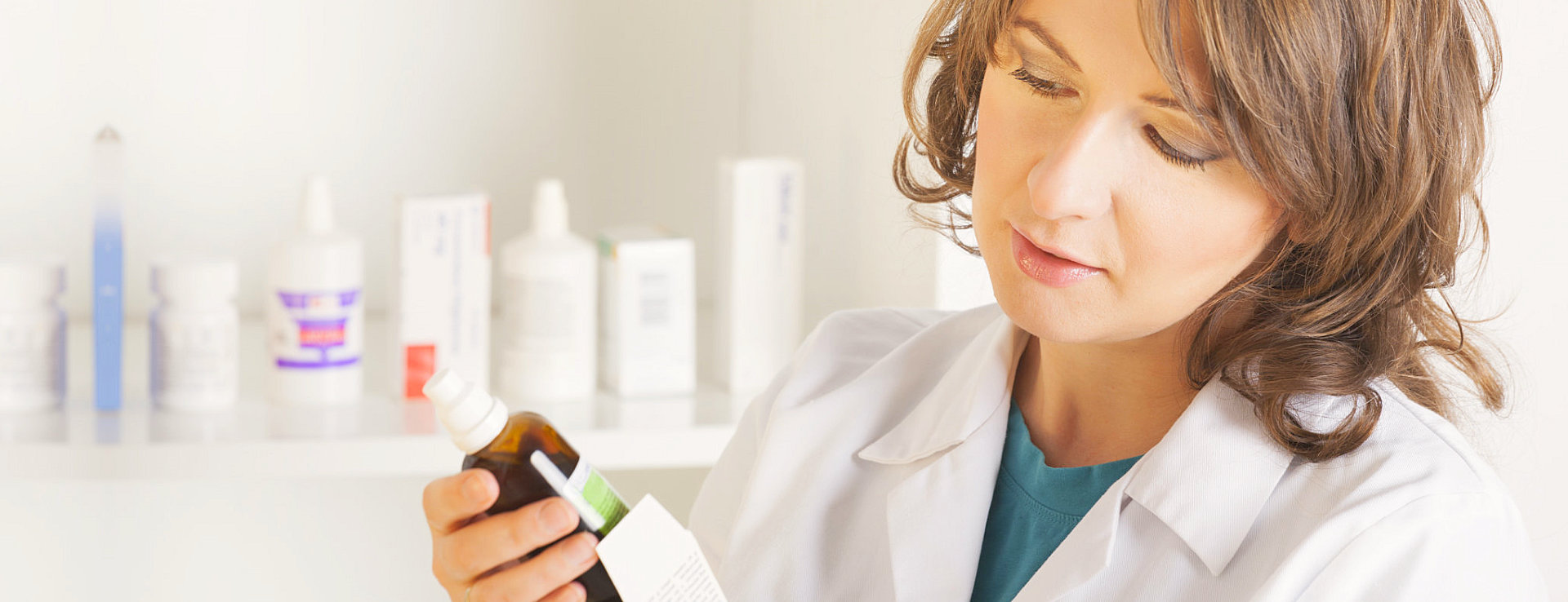 pharmacist holding a medicine